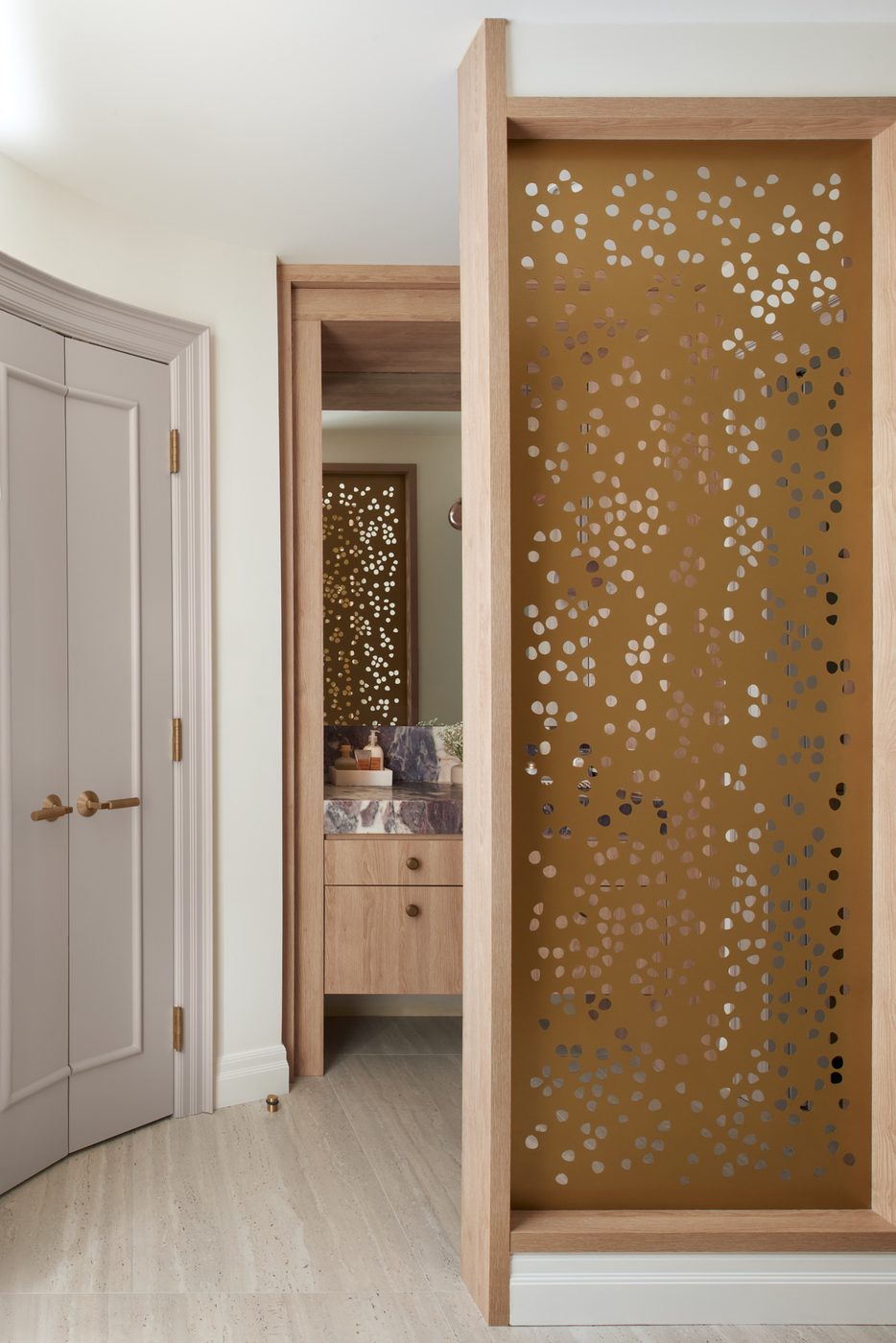 Custom perforated brass screen and vanity, York Downs residential renovation by Pro-Con Construction
